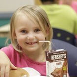 Young girl eating a meal as part of the Food for Kids program managed by the Community Food Bank of Eastern Oklahoma.